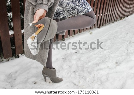 Woman wearing high heels in winter