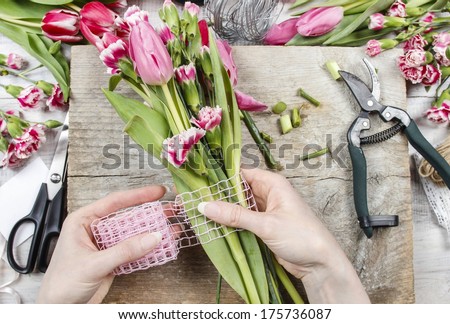 Florist at work Woman making spring floral decorations Florist at work Woman making spring floral decorations