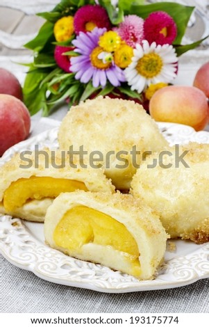 Peach in pastry, popular austrian dish. Garden party table