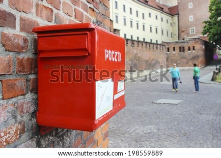 KRAKOW,POLAND - JUNE 14, 2014: Red mail box at the Wawel castle hill, Krakow, Poland