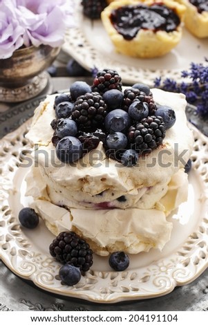 Pavlova cake with blueberries and blackberries