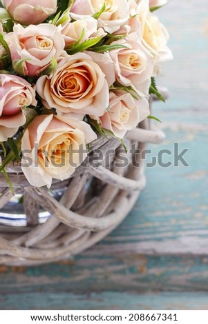 Bouquet of roses in wicker basket