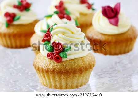 Wedding reception cupcakes decorated with sugarcraft red roses