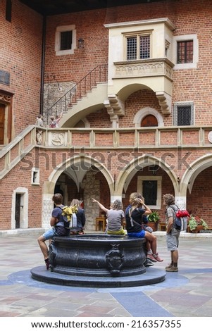 KRAKOW,POLAND - SEPTEMBER 10,2014: Tourists visiting the Jagiellonian University. The oldest university in Poland, the second oldest university in Central Europe. Collegium Maius