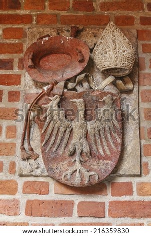 KRAKOW,POLAND - SEPTEMBER 10,2014: The Jagiellonian University. The oldest university in Poland, the second oldest university in Central Europe. State emblem on the wall of Collegium Maius