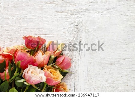 Bouquet of pink and orange roses on white background