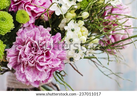 Bouquet of pink carnation, arabian star flower (ornithogalum arabicum) and green chrysanthemums