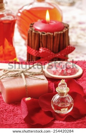 Spa set: scented candle, sea salt, liquid soap and romantic red rose petals
