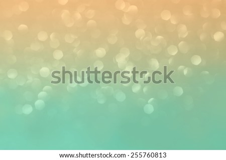 Peach and turquoise glittering background.