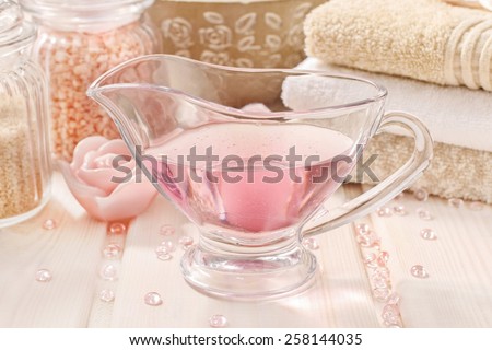 Pink spa set: liquid soap, scented candles, towels and rose sea salt