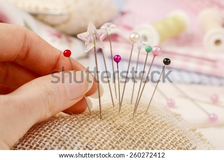 Pin cushion with sewing pins