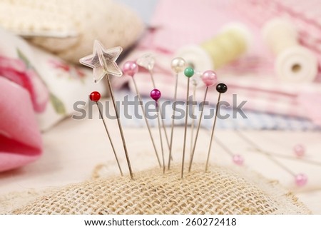 Pin cushion with sewing pins