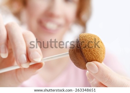 How to make cake pops, step by step, tutorial. Woman making cake pops.