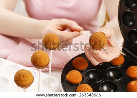 How to make cake pops, step by step, tutorial. Woman making cake pops.