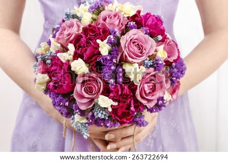 Wedding bouquet with roses and carnations