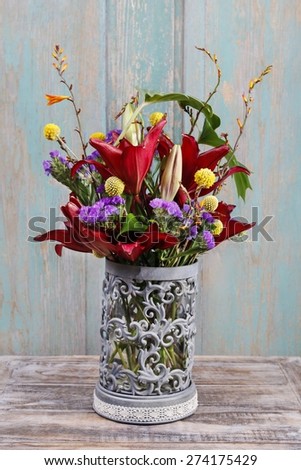 Floral arrangement with red lilies