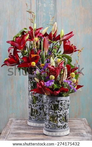 Floral arrangement with red lilies