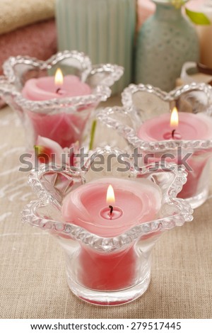 Pink scented candles in glass candle holders