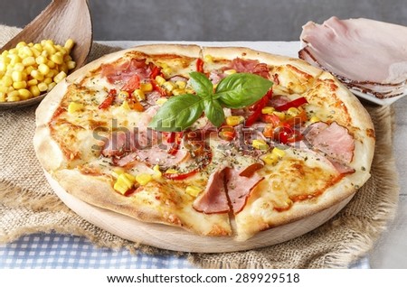 Pizza with ham, corn and pepper