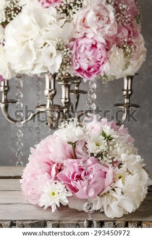 Floral arrangement with pink peonies, white chrysanthemums and gypsophila paniculata twigs