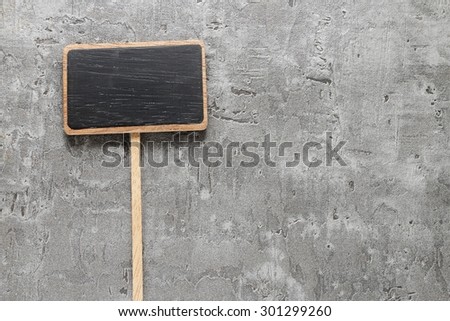 Blank chalkboard on gray stone background