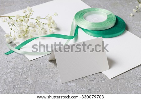 Florist at work. How to make place card with handwritten name, decorated with flowers.