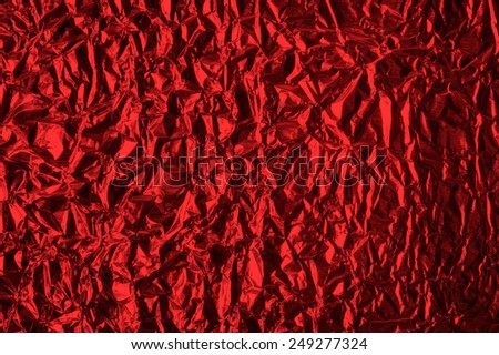 Thin sheet , leaf background with shiny crumpled uneven surface
