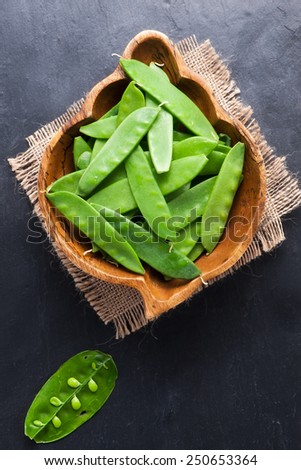 fresh organic mangetout, also known as sugar snap pea