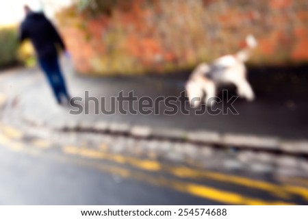 Man runs with his dog outside. Intentional motion blur