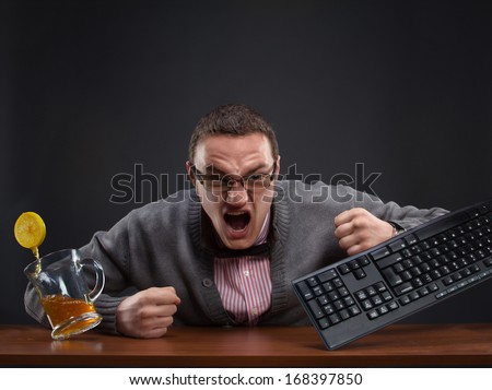 Angry man at the computer