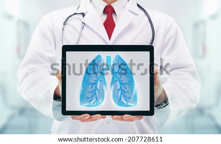 Doctor with stethoscope and tablet in a hospital