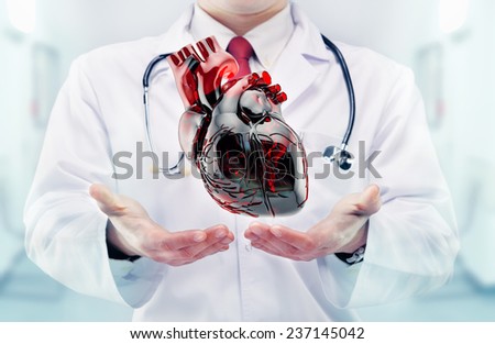 Doctor with heart in hands in a hospital