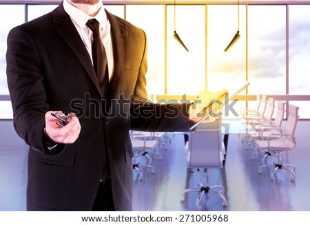 Hipster business man  with digital tablet on blurred background office. High resolution.