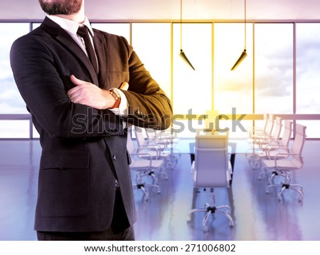 Hipster business man on blurred background office. High resolution