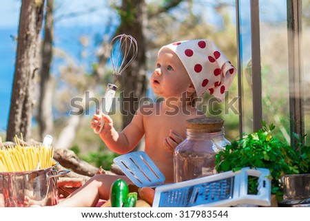 Happy children cook. Funny kids playing outdoors. Summer vacation concept
