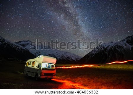 A Motorhomes Parked Under Milky Way Galaxy Rising Above Snow Capped Southern Alps Mountain Range At Mount Cook National Park, Canterbury, New Zealand. \
Image Noise Due To High ISO