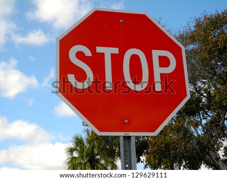 Stop Sign This is a regulation octagonal stop sign in red and white.