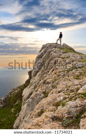 Man Climbing Cliff