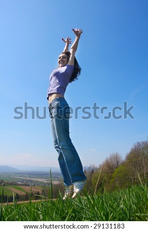 Woman jump on the meadow