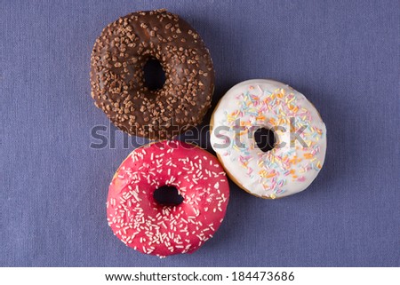 Donuts at the table with violet background