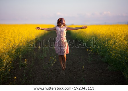 happy woman  in the yellow meadow