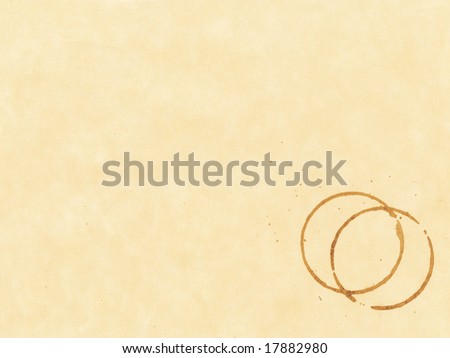 Coffee stain on beige textured paper