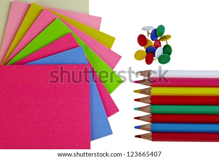 Colorful  note papers pencils and pushpins on white