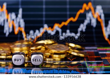 Dices cubes with the words SELL BUY, golden coins and a financial chart as the background. Selective focus