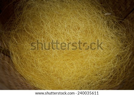Raw silk yellow gold in a basket waiting for the garment.