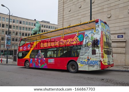 Brussels, Belgium - December 28, 2012: World famous red sightseeing bus waiting for tourists on the street of Brussels