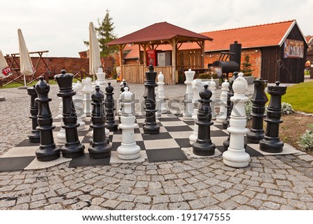 Gniew, Poland - May 07, 2014: Giant chess figures at the yard of medieval Mewe castle in Gniew town, Poland