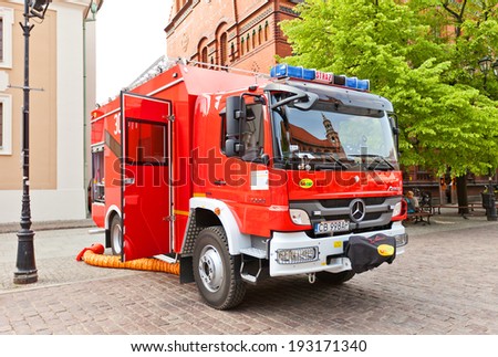 Torun, Poland - May 06, 2014: Fire-fighting vehicle Mercedes at Fire Service Day celebration on square Rynek Staromiejski  in Torun, Poland