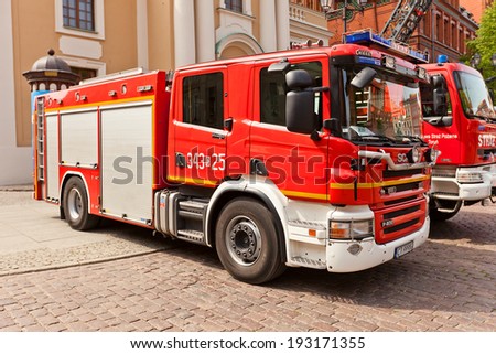 Torun, Poland - May 06, 2014: Fire-fighting vehicle Scania at Fire Service Day celebration on square Rynek Staromiejski  in Torun, Poland