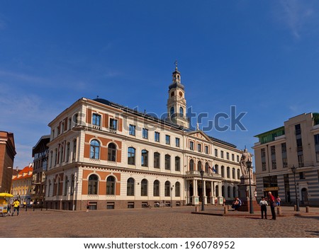 Riga, Latvia - May 25, 2014: City Council at Town Hall Square (Ratslaukums), historic center of Riga (UNESCO site), Latvia. Replica of XVIII c. Town Hall was made in 2003